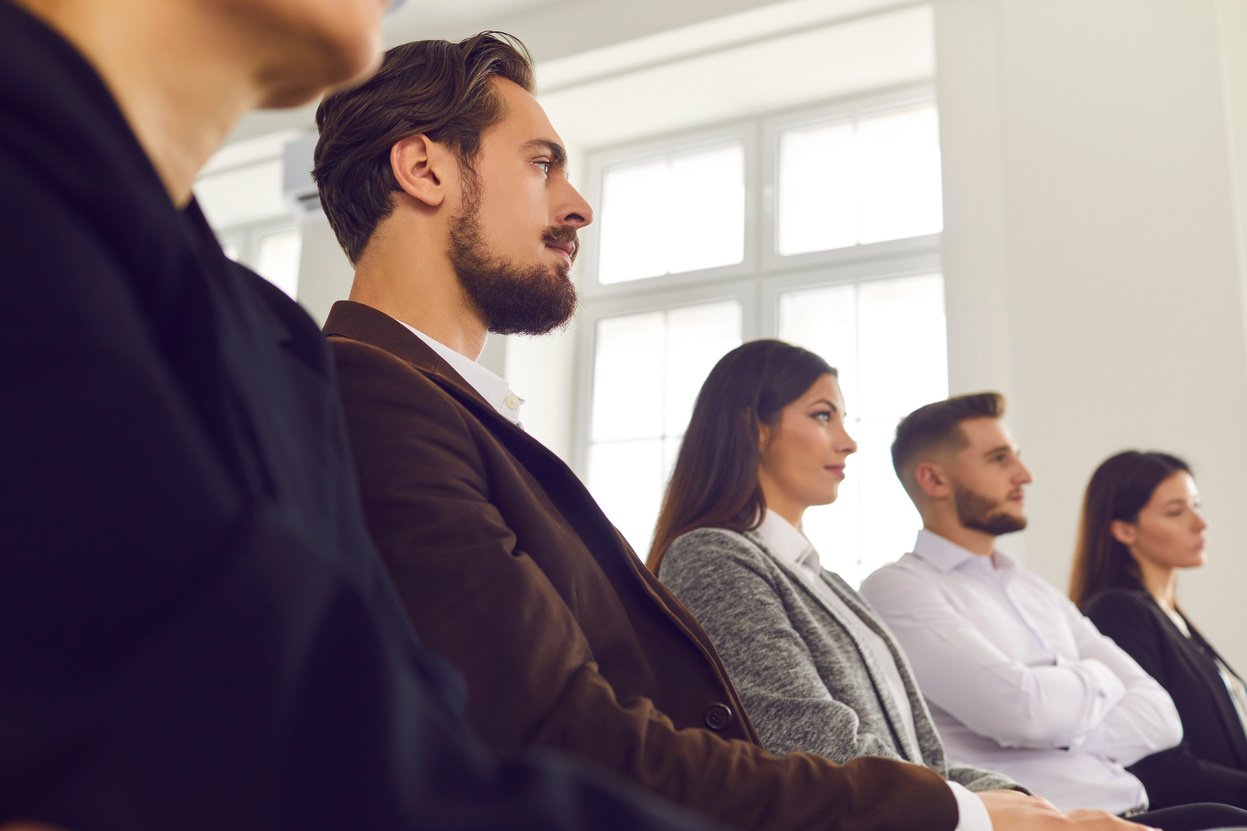 Serious Audience Listening to Speaker during Conference, Seminar or Corporate Meeting